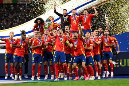 Alvaro Morata lifts the Henri Delaunay trophy after Spain defeats England in the Euro 2024 final.
