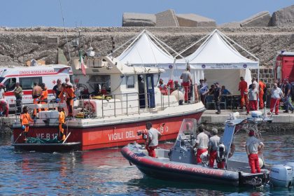 A body bag is brought ashore at Porticello harbor, Sicily, August 23, 2024.