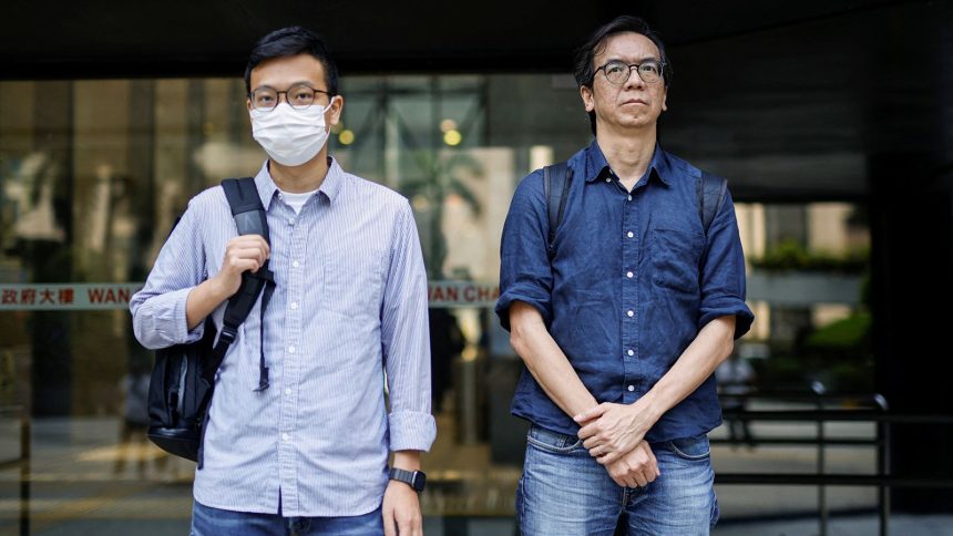 Chung Pui-kuen, former editor-in-chief of the now-shuttered Stand News, and Patrick Lam, former acting editor, leave court on June 27, 2023 after a hearing on charges of conspiring to publish seditious publications in Hong Kong.