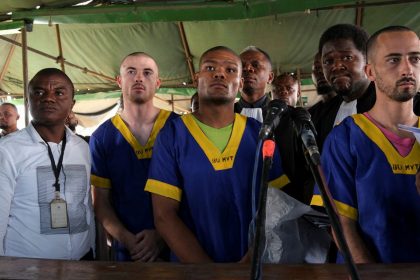 Benjamin Zalman Polun, Marcel Malanga and Taylor Thompson, American citizens suspected, along with a group of more than 50 other people, to be involved in an attempted coup in Congo, wait for the beginning of their trial in Kinshasa, Democratic Republic of Congo, June 7, 2024.