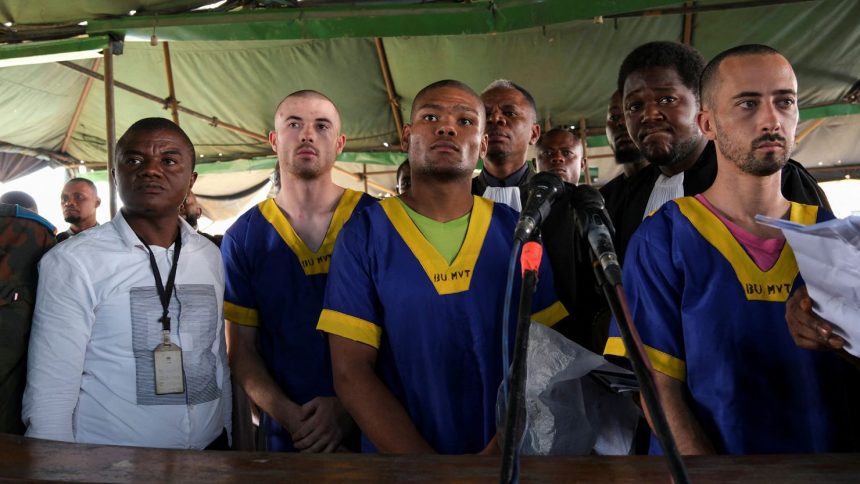 Benjamin Zalman Polun, Marcel Malanga and Taylor Thompson, American citizens suspected, along with a group of more than 50 other people, to be involved in an attempted coup in Congo, wait for the beginning of their trial in Kinshasa, Democratic Republic of Congo, June 7, 2024.