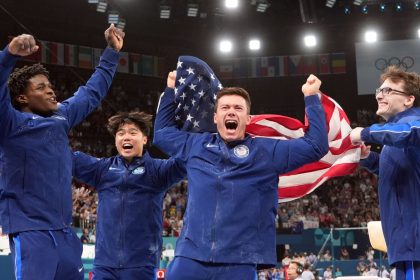 Team USA's Frederick Richard, Asher Hong, Brody Malone and Stephen Nedoroscik celebrate after winning bronze during the men’s team final at Bercy Arena on July 29 in Paris.