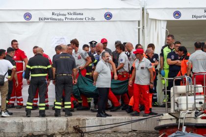 Rescue personnel transport a body after a luxury yacht, which was carrying British entrepreneur Mike Lynch, sank off the coast of Porticello, near the Sicilian city of Palermo, Italy, August 21, 2024. REUTERS/Louiza Vradi