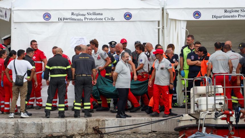 Rescue personnel transport a body after a luxury yacht, which was carrying British entrepreneur Mike Lynch, sank off the coast of Porticello, near the Sicilian city of Palermo, Italy, August 21, 2024. REUTERS/Louiza Vradi