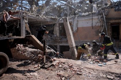 Ukrainian emergency personnel work among the rubble of a destroyed hotel in Kramatorsk on Sunday.