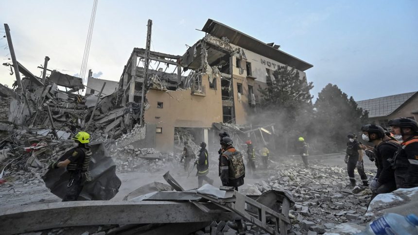 Rescuers work at a site of a Russian missile strike, amid Russia's attack on Ukraine, in Kryvyi Rih, Ukraine on August 27, 2024. REUTERS/Stringer