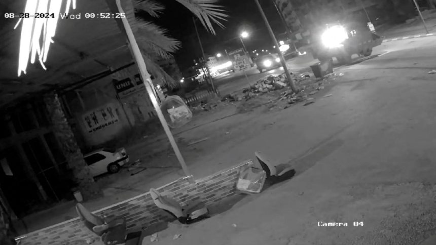 In this closed-circuit television footage obtained from social media, Israeli military vehicles travel along a road as they operate in Jenin, in the Israeli-occupied West Bank, on August 28, 2024.