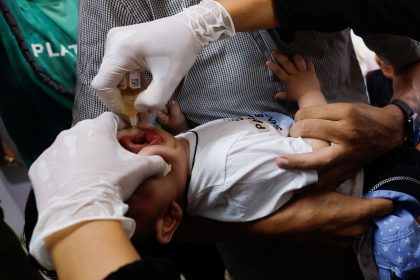 A Palestinian child is vaccinated against polio at Nasser Hospital in Khan Younis, central Gaza, on Saturday.