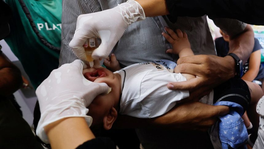 A Palestinian child is vaccinated against polio at Nasser Hospital in Khan Younis, central Gaza, on Saturday.