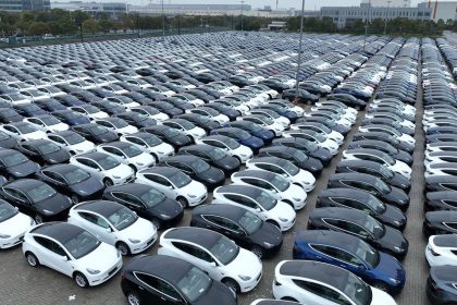 SHANGHAI, CHINA - MARCH 30: Aerial view of Tesla electric vehicles to be shipped aboard sitting parked at Nangang Port on March 30, 2023 in Shanghai, China. (Photo by Shen Chunchen/VCG via Getty Images)