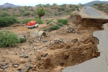 A truck bypasses a damaged road after intense flooding caused damage to infrastructure in southwest Yemen.