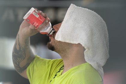 A construction worker hydrates at the Shedd Aquarium Tuesday, Aug. 27, 2024, as a second straight day of hot soupy temperature hung over much of the Midwest in Chicago.