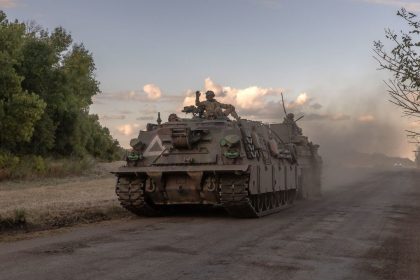 Ukrainian servicemen operate an armored military vehicle in the Sumy region near the border with Russia on August 12.