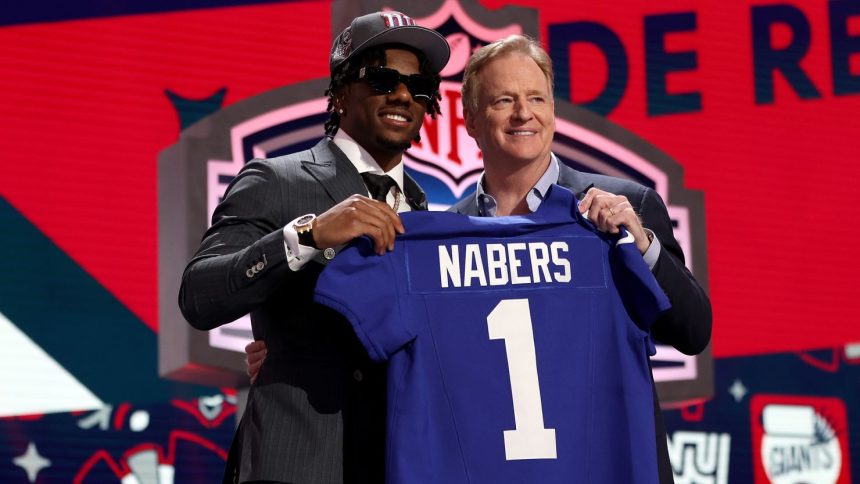 Nabers poses with NFL Commissioner Roger Goodell after being selected sixth overall by the New York Giants.