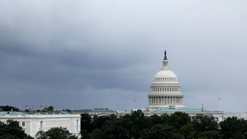 Rain clouds hang over the US Capitol Building on August 9, 2024 in Washington, DC.