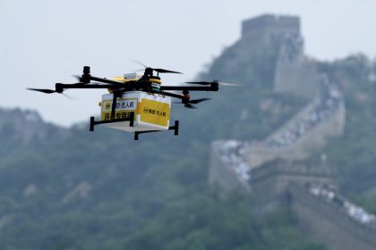 A drone carries a package from Chinese food delivery giant Meituan to the Badaling section of the Great Wall in Beijing, China, on August 16, 2024.