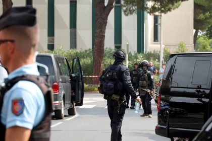 Law enforcement officers stand nearby a synagogue in La Grande-Motte, France, following a purported arson attack on Saturday.