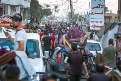 Palestinians move patients from Al Aqsa Martyrs Hospital after the Israeli military issued evacuation orders in an area east of Deir al-Balah, Gaza.