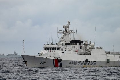 A China Coast Guard ship and a vessel identified by the Philippine Coast Guard as a Chinese navy ship are seen in disputed waters of the South China Sea on August 26, 2024.