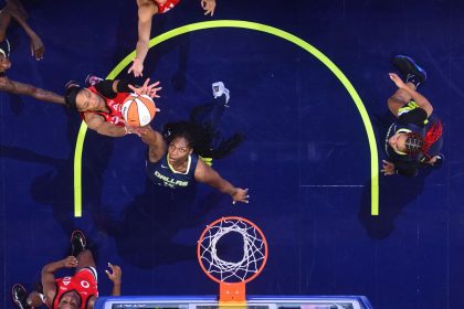 A'ja Wilson (left) goes for a rebound against the Dallas Wings.