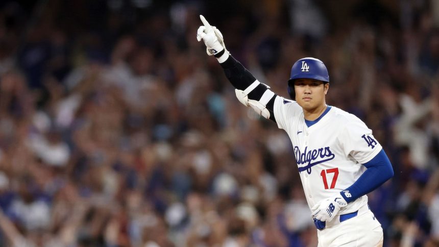 Shohei Ohtani of the Los Angeles Dodgers celebrates after hitting a walk-off grand slam home run, his 40th home run of the season.