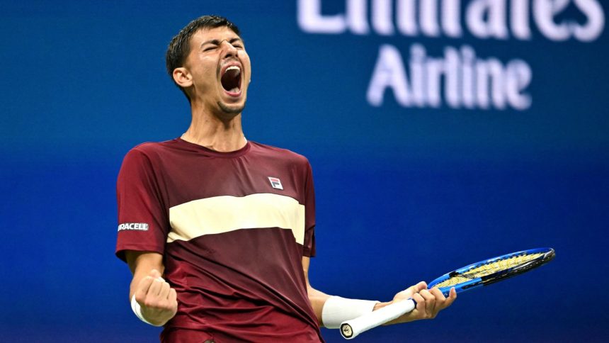 Alexei Popyrin celebrates winning a break point against Novak Djokovic.