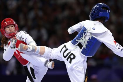 PARIS, FRANCE - AUGUST 29: Zakia Khudadadi of Refugee Paralympic Team and Nurcihan Ekinci of Team Turkey compete in the Women's K44-47kg Repechage, Contest 128 on day one of the Paris 2024 Summer Paralympic Games at Grand Palais on August 29, 2024 in Paris, France. (Photo by Steph Chambers/Getty Images)