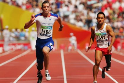 John McFall of Great Britain and Atsushi Yamamoto of Japan compete in the final of the Men's 100M at the 2008 Paralympic Games.