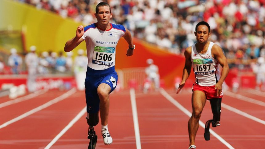 John McFall of Great Britain and Atsushi Yamamoto of Japan compete in the final of the Men's 100M at the 2008 Paralympic Games.