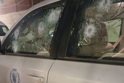 A photo released by the World Food Program shows multiple bullet marks in the driver's side window; in total, at least 10 bullets hit the vehicle, according to the agency.