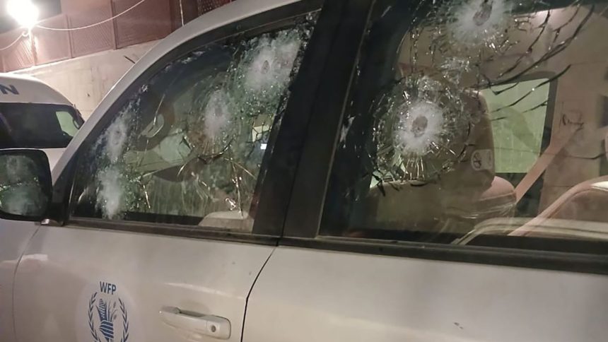 A photo released by the World Food Program shows multiple bullet marks in the driver's side window; in total, at least 10 bullets hit the vehicle, according to the agency.