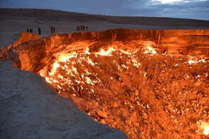 Welcome to the 'Gates Of Hell': Visitors line the edge of the Darvaza "Gates of Hell" gas crater in Turkmenistan's Karakum Desert.