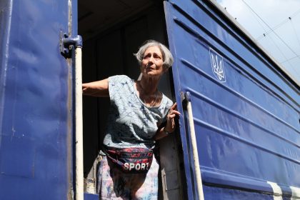 A woman from the Pokrovsk area boards an evacuation train amid continuing Russian advances toward the city.