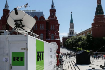 Vehicles of Russian state-controlled broadcaster Russia Today (RT) are seen near the Red Square in central Moscow, Russia June 15, 2018.