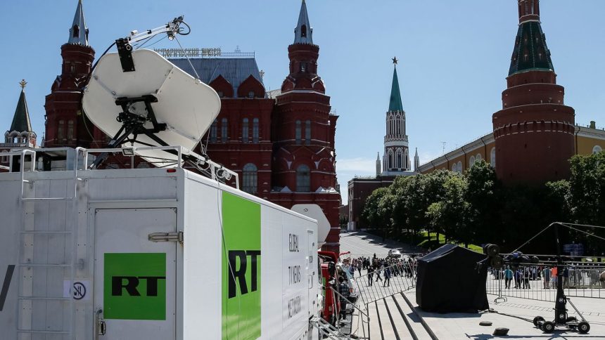 Vehicles of Russian state-controlled broadcaster Russia Today (RT) are seen near the Red Square in central Moscow, Russia June 15, 2018.