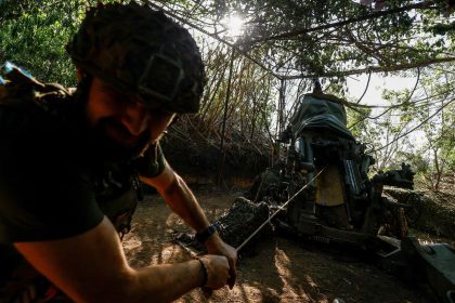 A Ukrainian serviceman of the 148th Separate Artillery Brigade of the Ukrainian Air Assault Forces, fires toward Russian troops near a front line, amid Russia’s attack on Ukraine, in Donetsk region, Ukraine May 1, 2024.