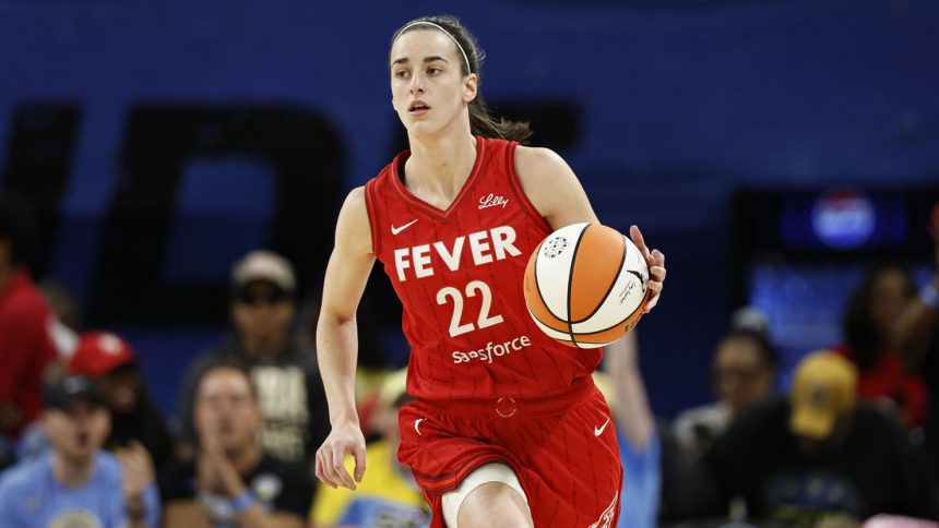 Caitlin Clark brings the ball up the court during a WNBA game against the Chicago Sky.