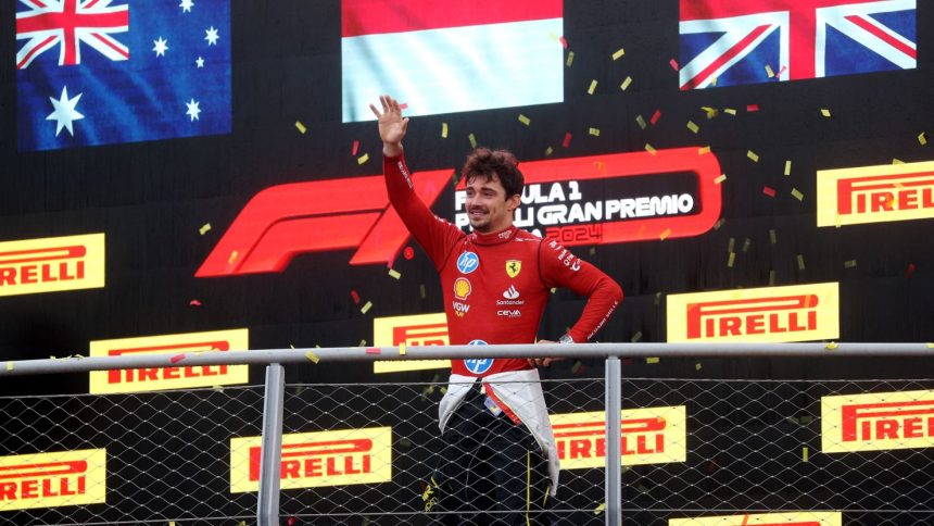 Formula One F1 - Italian Grand Prix - Autodromo Nazionale Monza, Monza, Italy - September 1, 2024 Ferrari's Charles Leclerc celebrates on the podium after winning the Italian Grand Prix REUTERS/Bernadett Szabo