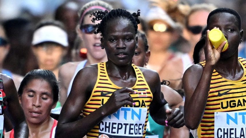 FILE PHOTO: Athletics - World Athletics Championship - Women's Marathon - National Athletics Centre, Budapest, Hungary - August 26, 2023 Uganda's Rebecca Cheptegei in action during the women's marathon final REUTERS/Dylan Martinez//File Photo