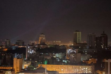 Ukrainian service personnel use searchlights as they search for drones in the sky over the city center during a Russian drone strike in Kyiv, Ukraine, September 7, 2024.