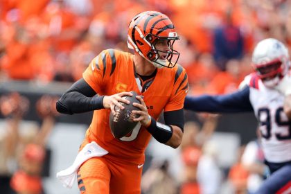 Joe Burrow runs the ball during the first quarter of the Cincinnati Bengals' game against the New England Patriots.