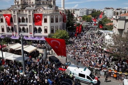 People carry the Turkish flag-draped coffin of Aysenur Ezgi Eygi, a Turkish-American activist killed in the Israeli-occupied West Bank, during her funeral ceremony in Didim.