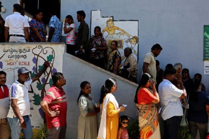 Voters line up outside a polling station to vote in the presidential election, in Colombo, Sri Lanka, on September 21, 2024.