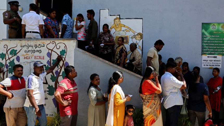 Voters line up outside a polling station to vote in the presidential election, in Colombo, Sri Lanka, on September 21, 2024.