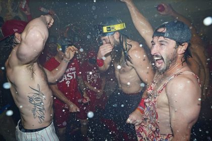 Philadelphia Phillies players celebrate winning the National League East Division title.