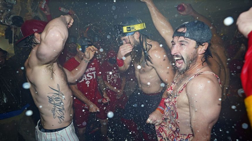 Philadelphia Phillies players celebrate winning the National League East Division title.