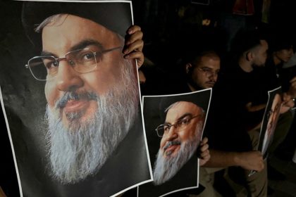 Supporters of Hezbollah leader Hassan Nasrallah carry his pictures as they gather in Sidon, Lebanon, following his killing in an Israeli airstrike in Beirut's southern suburbs on September 28, 2024.