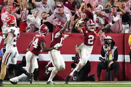 Alabama Crimson Tide celebrate their win against the Georgia Bulldogs.