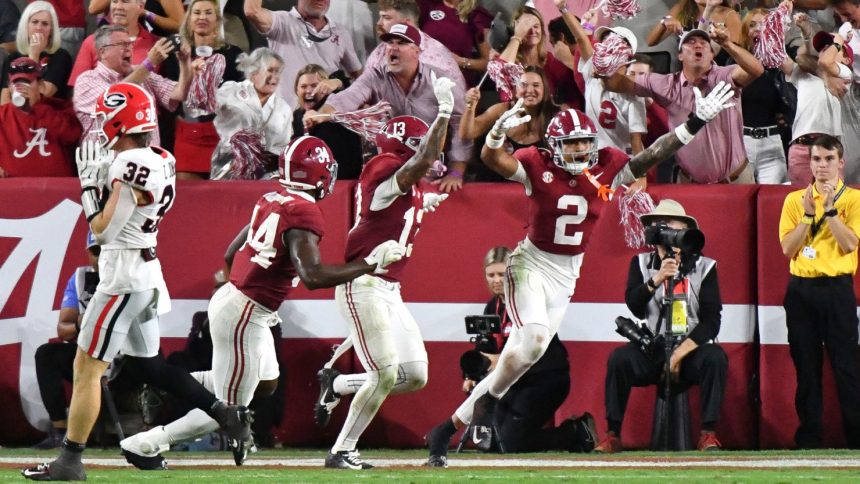 Alabama Crimson Tide celebrate their win against the Georgia Bulldogs.