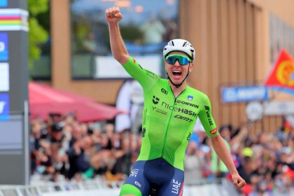 Tadej Pogačar celebrates winning the world championship men's road race.